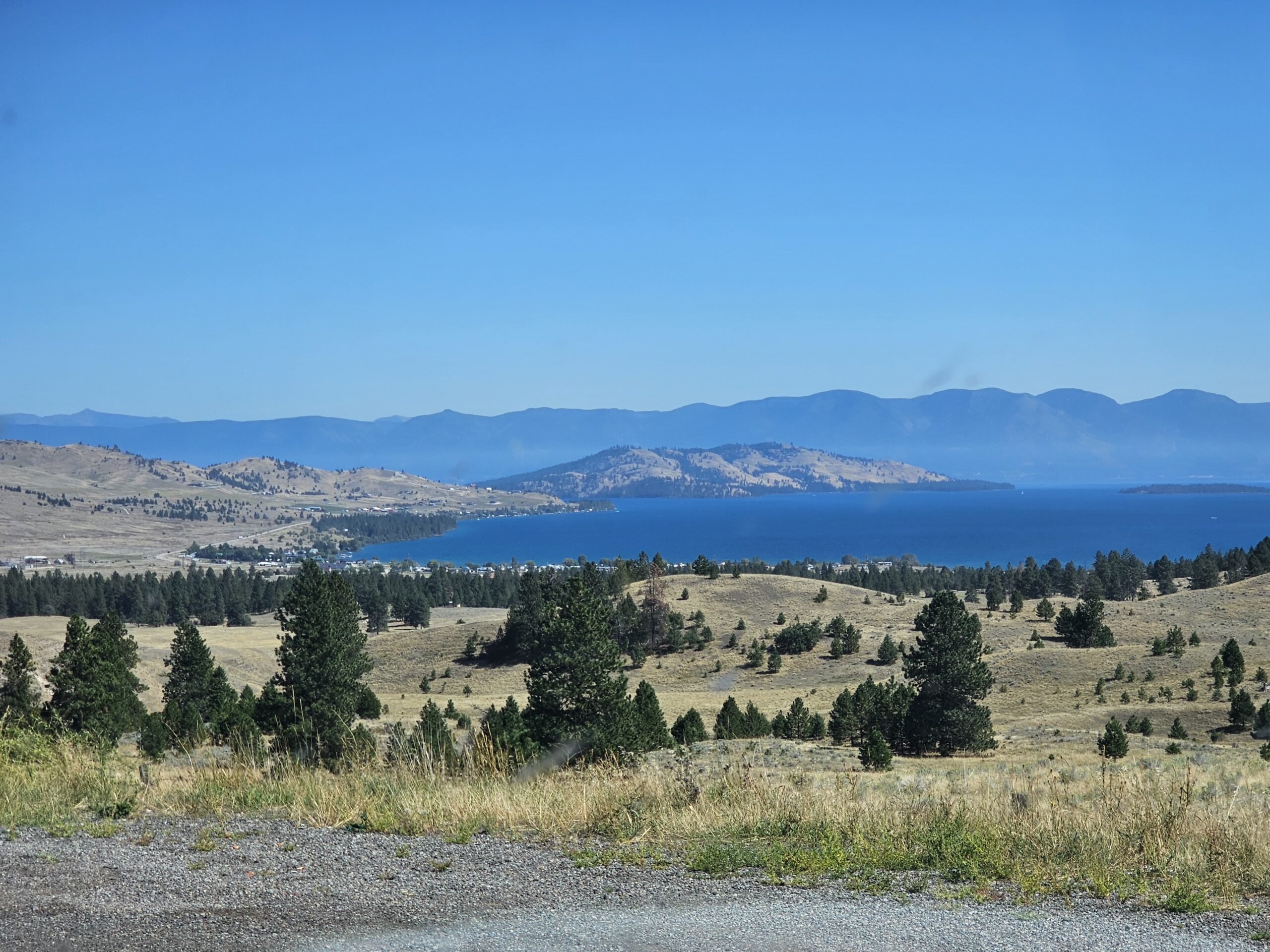 Beautiful scenic overlook in Lake Coeur d’Alene with mountain peaks and clear water reflections