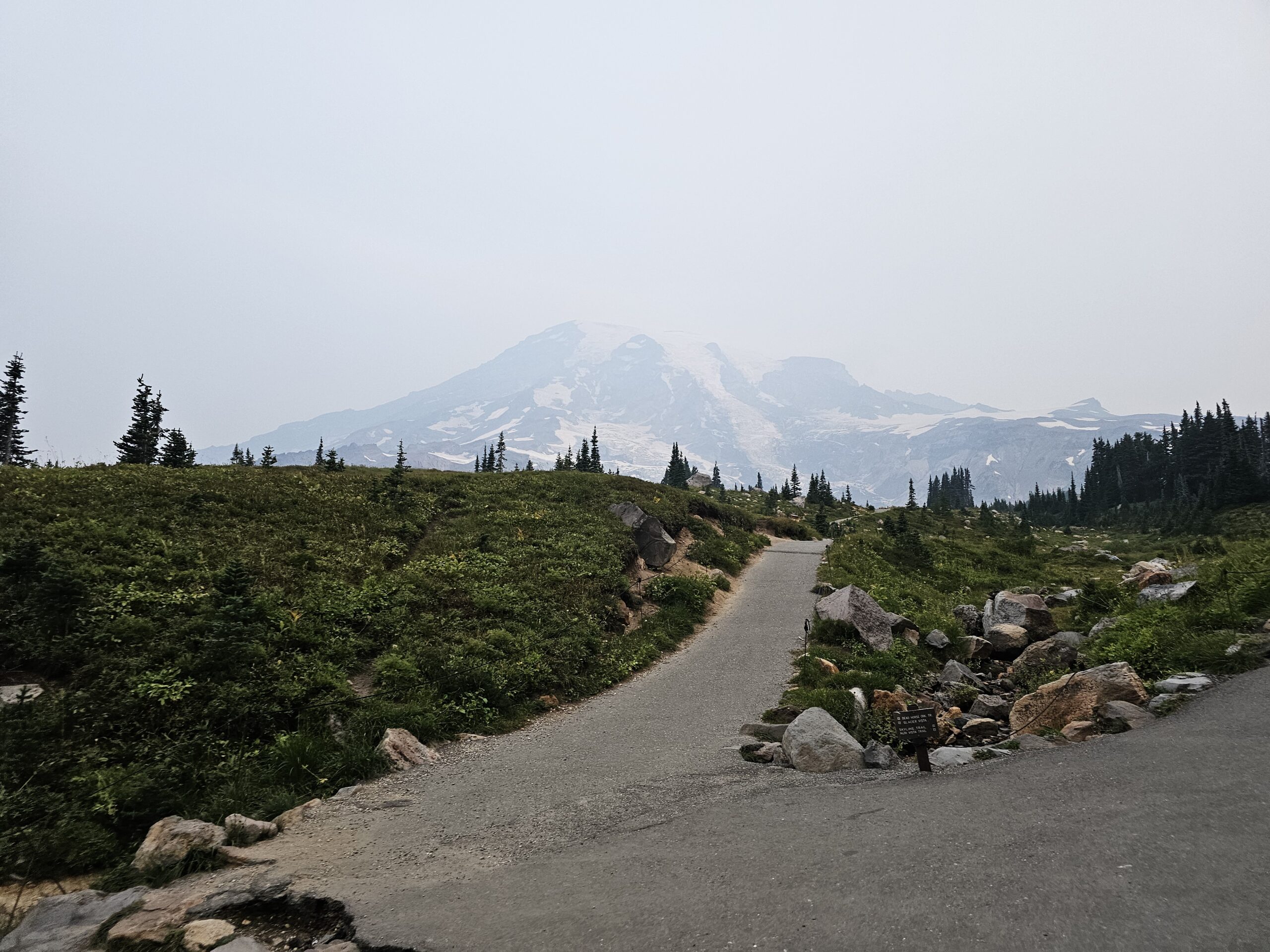 Walking along the sky loop trail path with Mount Ranier in the background