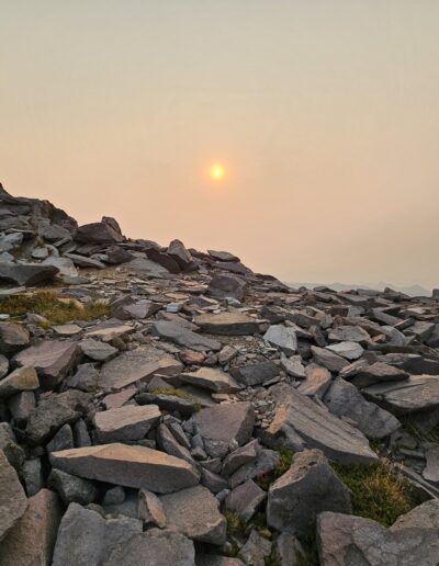 The sun rising above the path on Mount Ranier